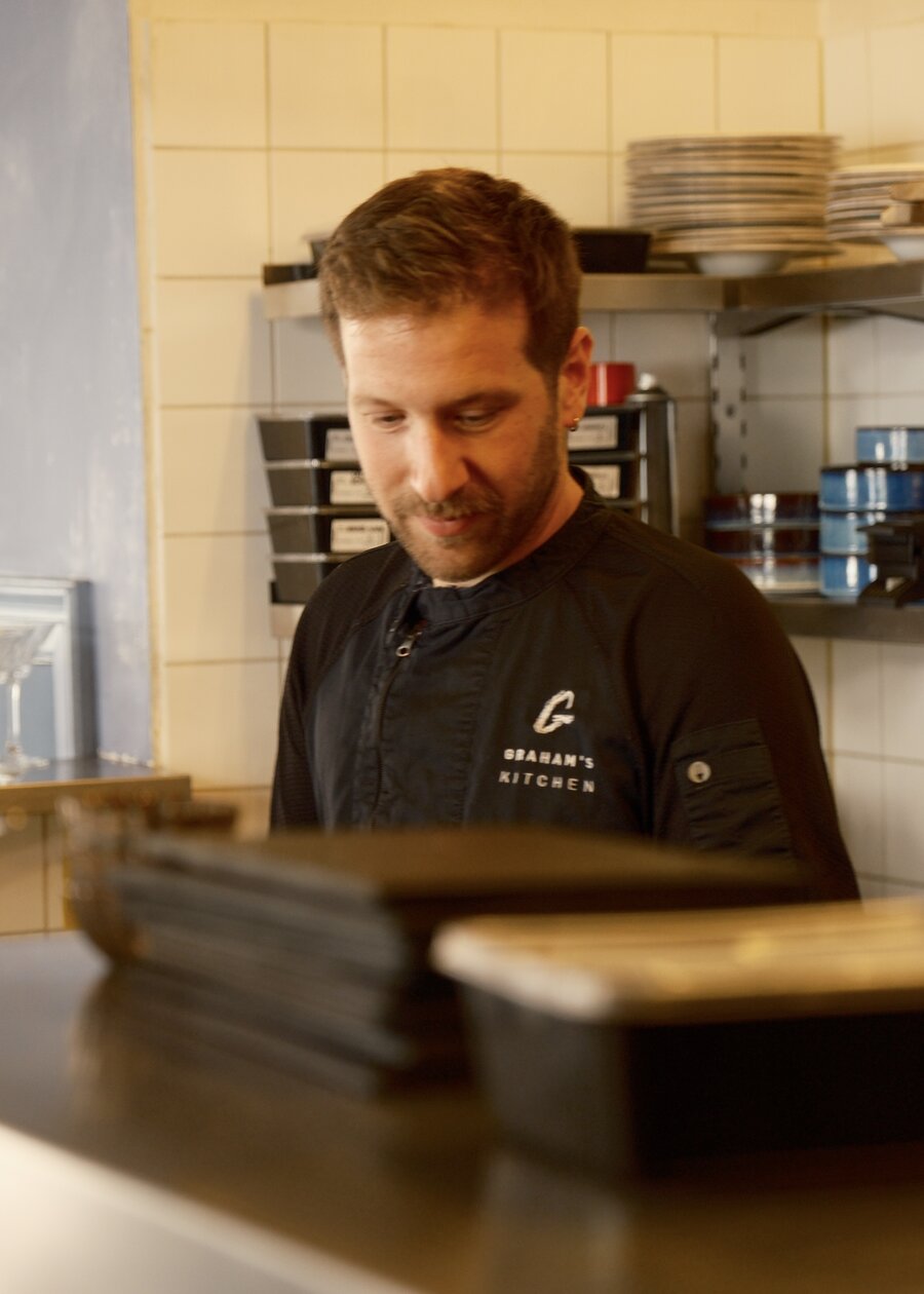 Head Chef Anastasios Metaxas at the pass in the kitchen